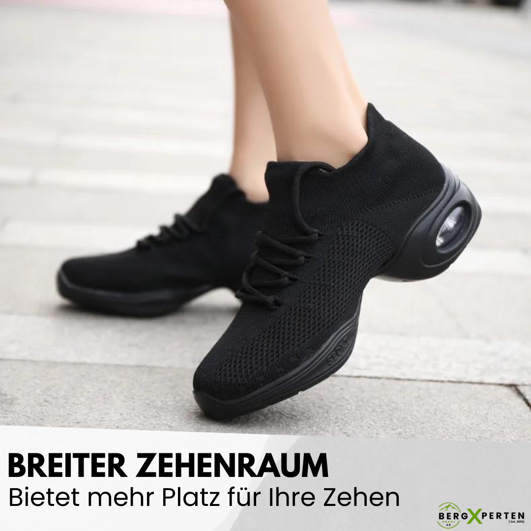 Ergonomiske Orthowalk sko i sort og hvid, tilbyder åndbar komfort og smertelindring for damer og herrer.