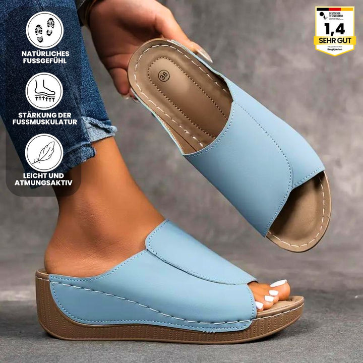 Ergonomiske, skridsikre sandaler i beige, der kombinerer komfort og stil, ideelle til enhver fodform og lejlighed.