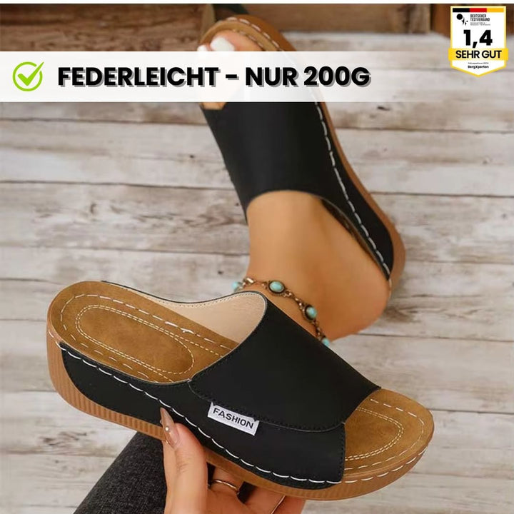 Ergonomiske, skridsikre sandaler i beige, der kombinerer komfort og stil, ideelle til enhver fodform og lejlighed.