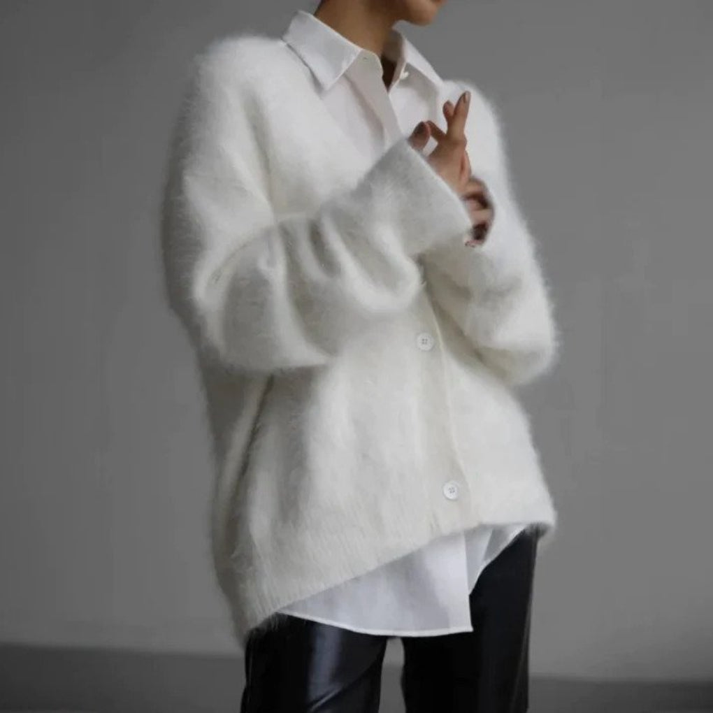 Klassisk dame cardigan med tidløst design. Alsidig og stilfuld overdel for elegant og afslappet dame mode.