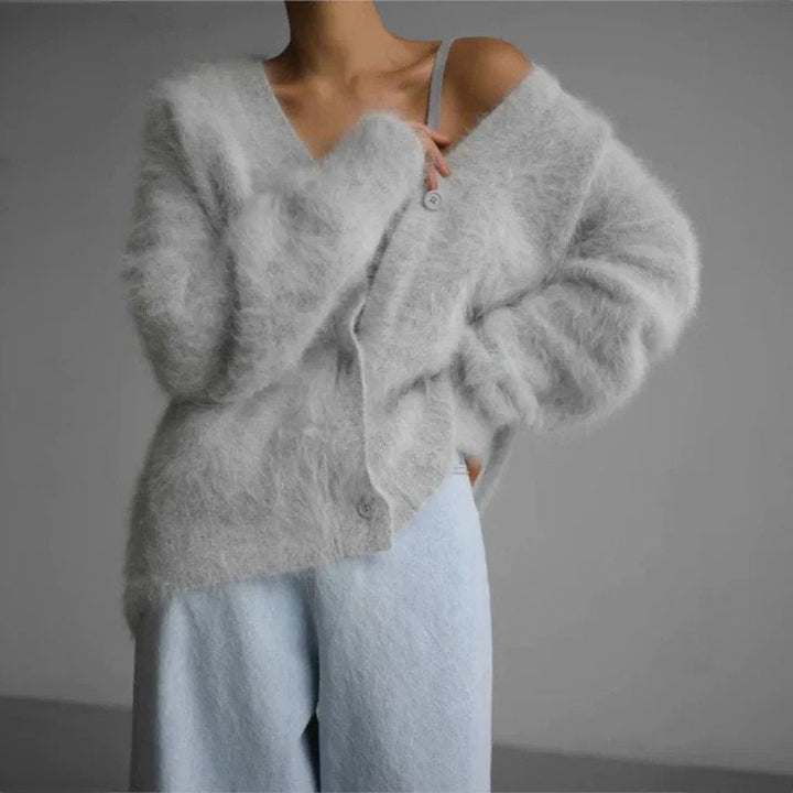Varm og komfortabel dame cardigan. Tidløst strikdesign, ideel som stilfuld overdel i elegant dame mode.