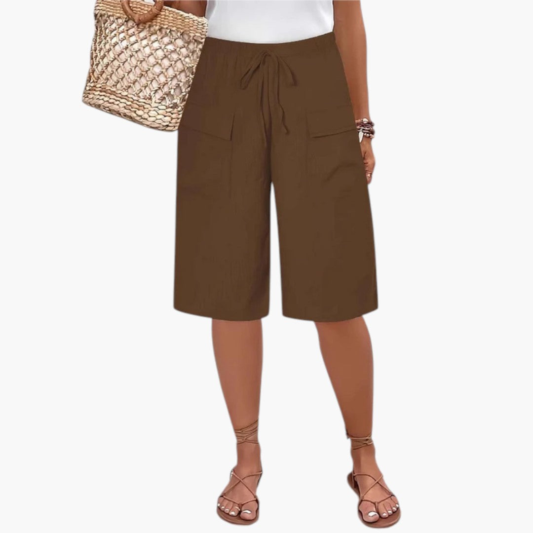 Orange kvinders sommer shorts med justerbar snor og elastisk talje for en stilfuld og afslappet pasform.