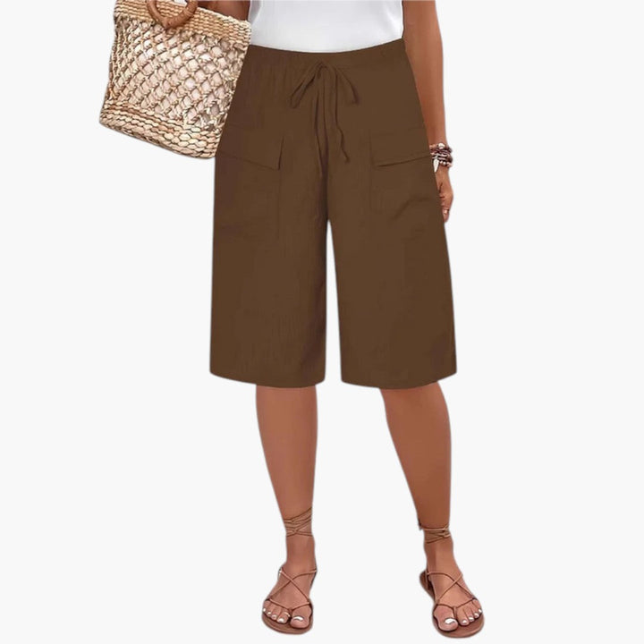 Orange kvinders sommer shorts med justerbar snor og elastisk talje for en stilfuld og afslappet pasform.