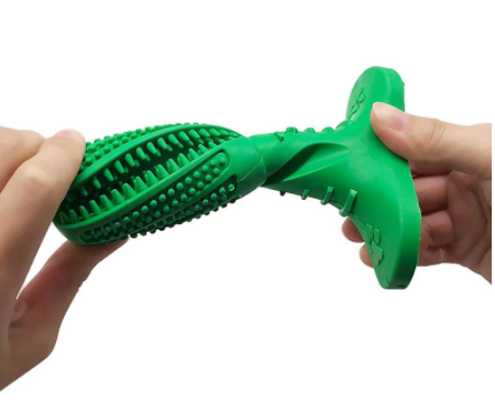 Grøn hundetænderbørste i gummi, sideansigt, med knopper til tandpleje, egnet til alle hunderacer.