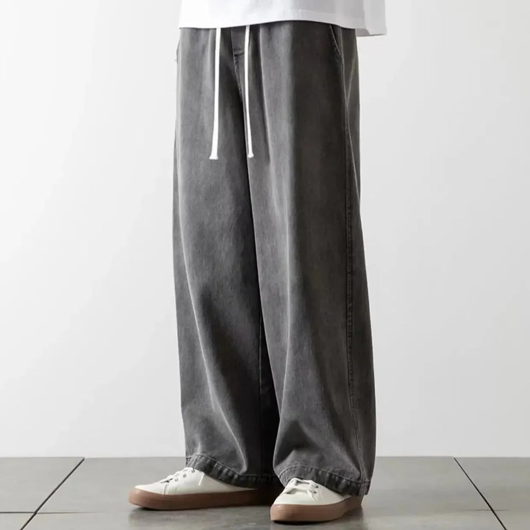 Blå denim baggy jeans til mænd med løs pasform og elastisk talje. Ideel til komfortabel, afslappet herremode.