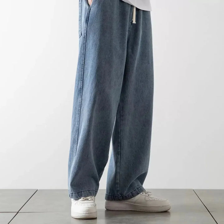 Sorte herre baggy jeans med løs pasform, perfekt til streetwear. Stilfulde og komfortable denimbukser.