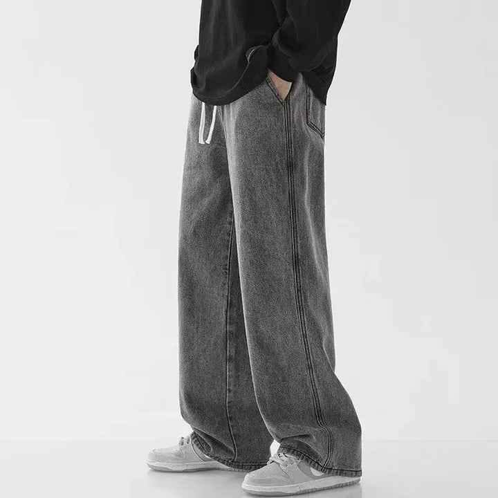 Sorte baggy herrejeans for et trendy streetwear-look. Afslappet pasform og behagelig elastisk talje.