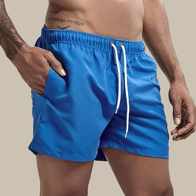 Turkise badeshorts til mænd, hurtigtørrende, elastisk linning, klassisk design; perfekt til sommeraktiviteter.