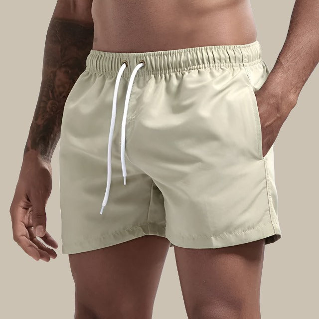 Turkise badeshorts til mænd, hurtigtørrende, elastisk linning, klassisk design; perfekt til sommeraktiviteter.
