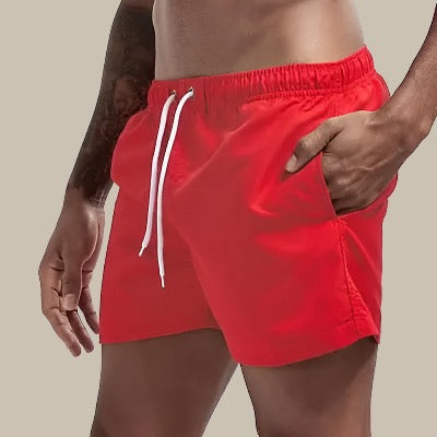 Turkise badeshorts til mænd, hurtigtørrende, elastisk linning, klassisk design; perfekt til sommeraktiviteter.