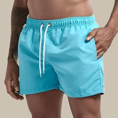 Turkise badeshorts til mænd, hurtigtørrende, elastisk linning, klassisk design; perfekt til sommeraktiviteter.