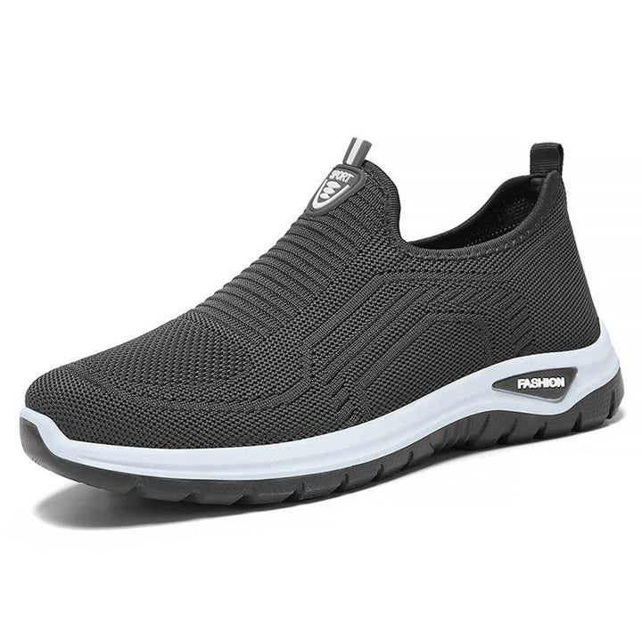 Herre slip-on sneakers, åndbare og fleksible, til byvandring og fritidsaktiviteter. Stilrent design i sort og grå.