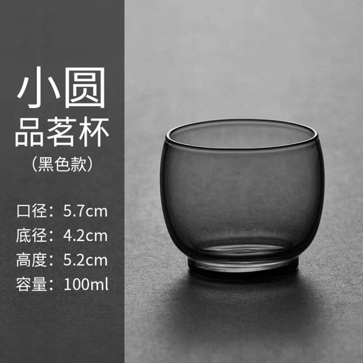 Smuk japansk glastekande til te, minimalistisk stil med praktisk træhåndtag.