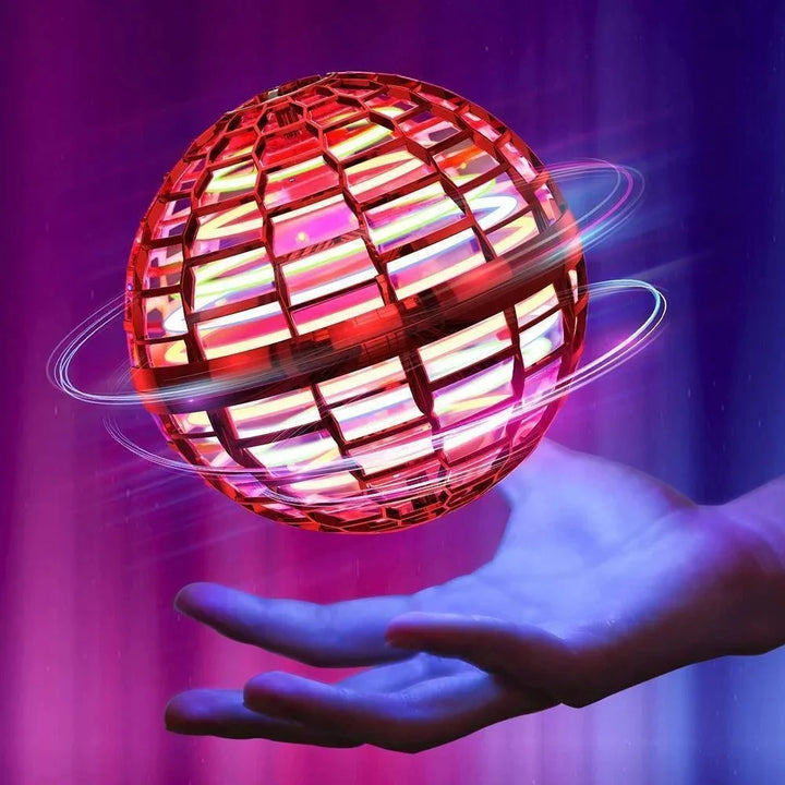 Børn leger med JoySphere flyvekugle, der lyser i farver og forbedrer motorik under indendørs leg.