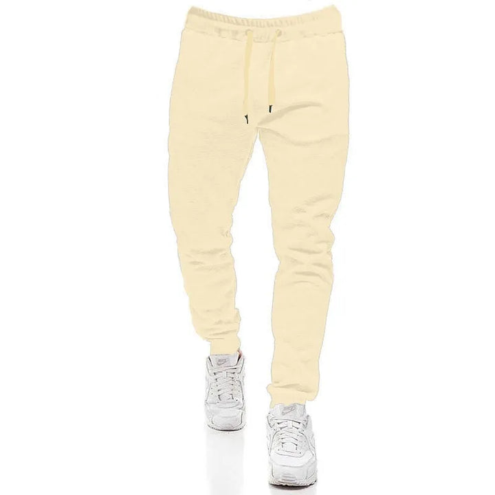 Moderne herre joggingbukser i grå melange, med snøre for optimal pasform, sporty og afslappede til mænd.