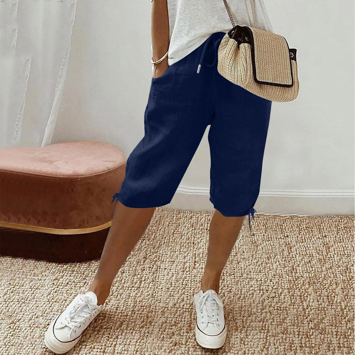 Grønne løse dame shorts, ideelle til varme dage, kombinerer komfort og mode.