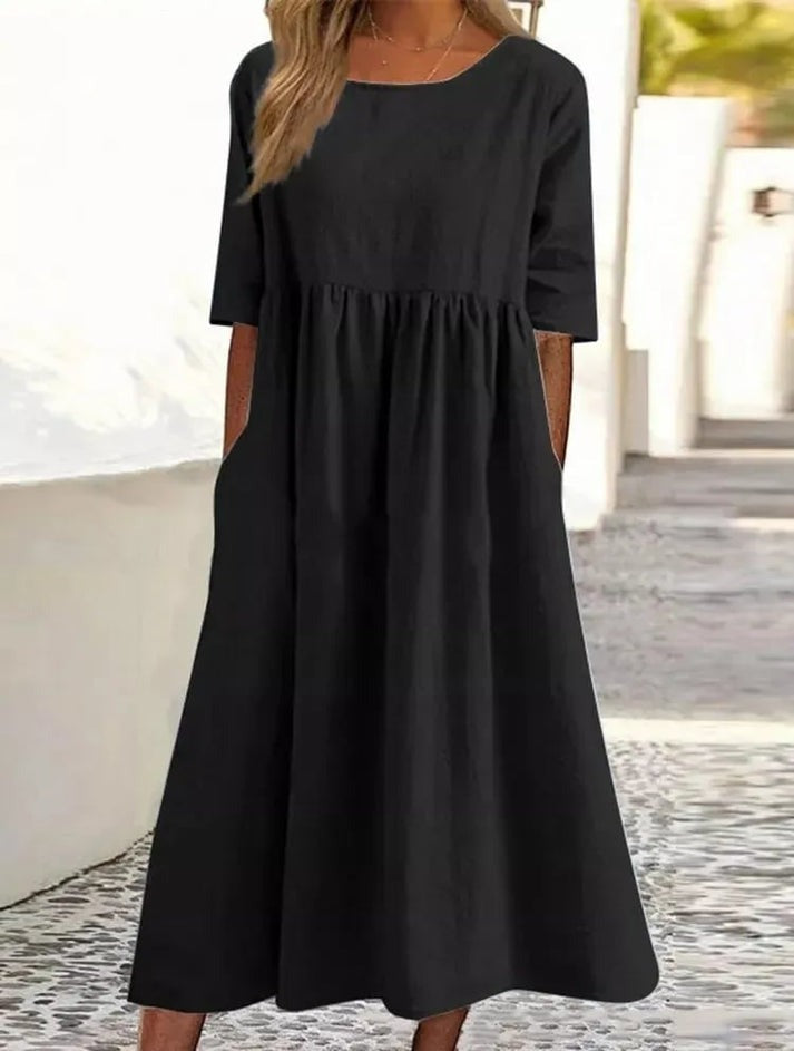 Let og elegant hverdagskjole til kvinder. Afslappet knapkjole med feminin silhuet. Perfekt som stilfuld sommerkjole.