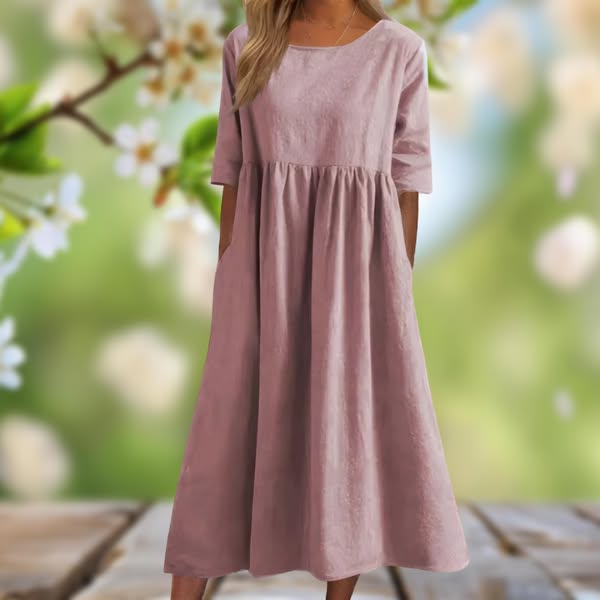 Detalje af knapper på en let og afslappet kvinde knapkjole. Flowy langkjole, ideel som feminin og stilfuld sommerkjole.