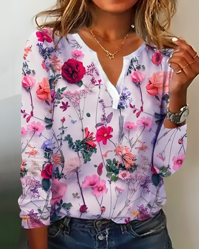Elegant langærmet blomsterbluse til kvinder med stilfuld V-hals. Perfekt til casual og elegante looks.