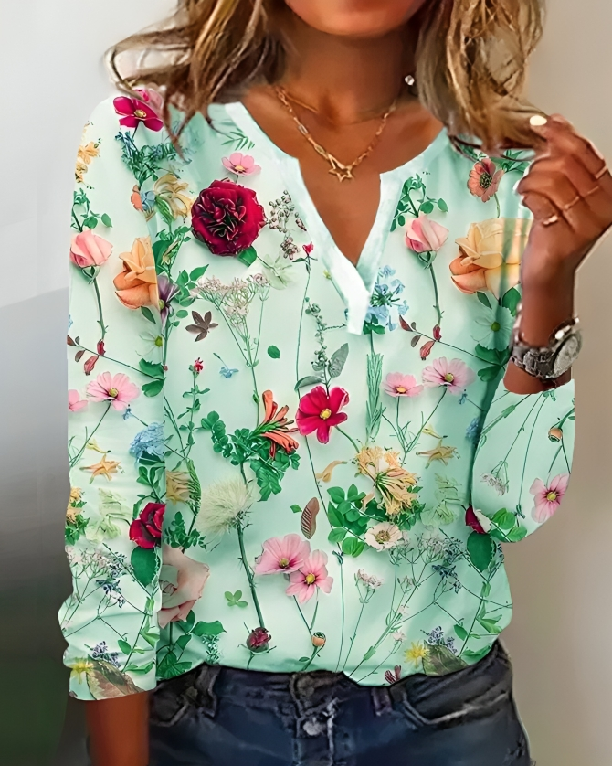 Detaljeret blomsterprint bluse til kvinder. Langærmet design med flatterende V-udskæring, ideel til sommer.