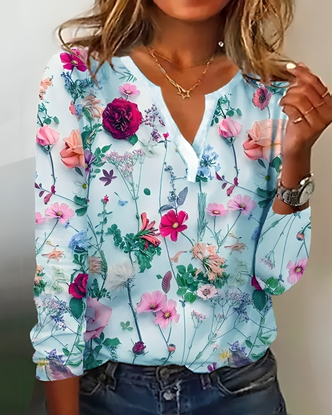 Feminin kvinders V-hals bluse med blomsterprint og lange ærmer. En alsidig top til både forår & sommer.