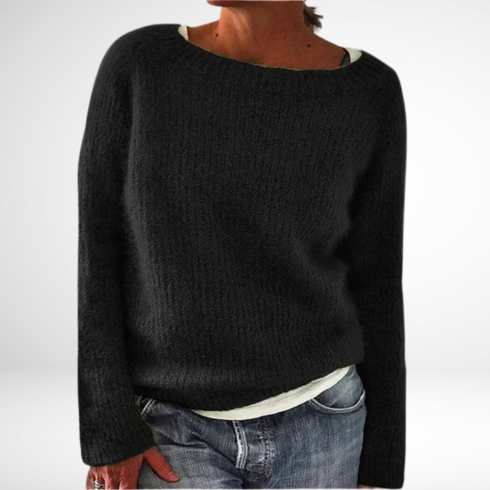 Elegant retro kvindesweater, strikket med farverige mønstre. Tidløs dameovertøj i fransk stil til vintermode.