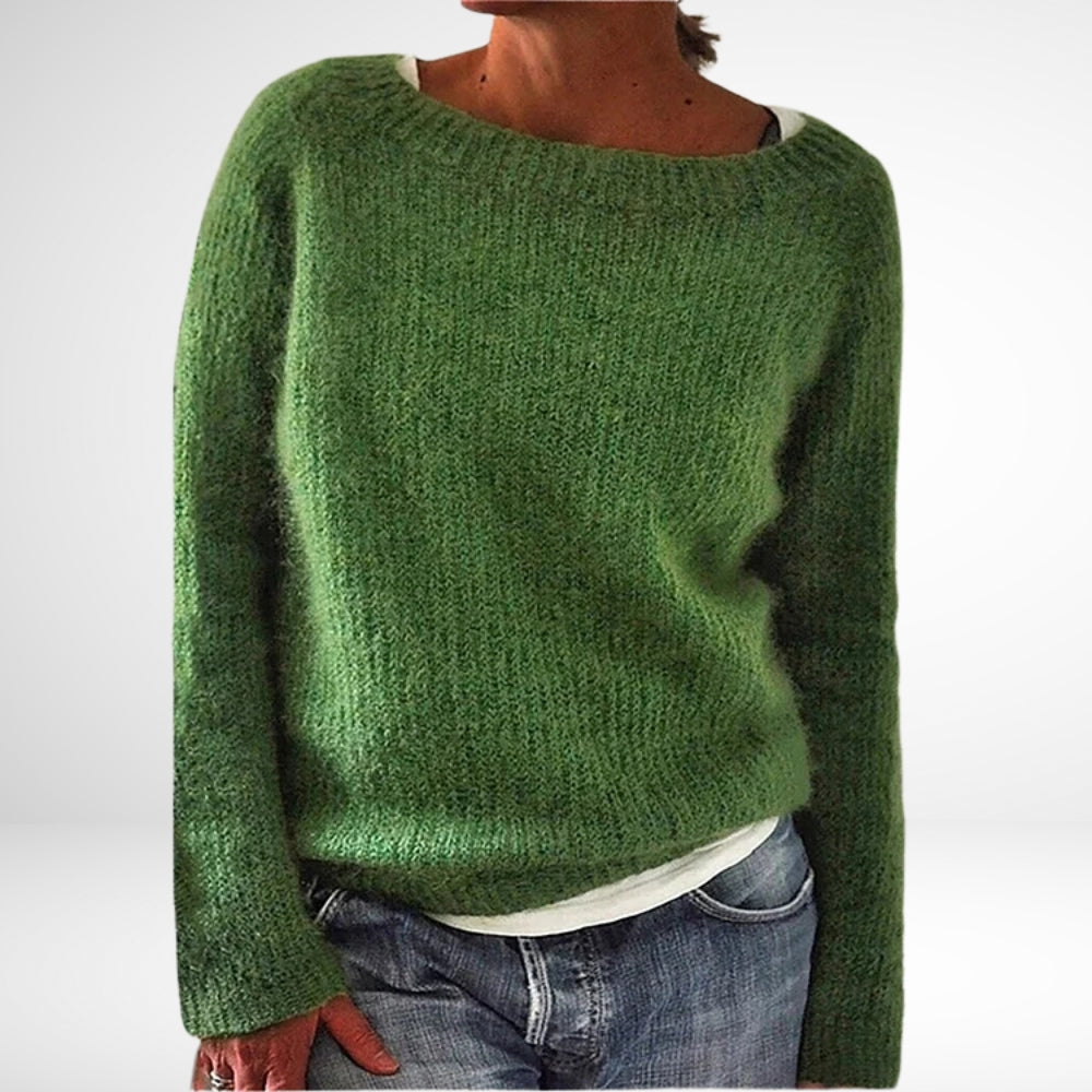 Strikket dameovertøj: hyggelig retro kvindesweater. Elegant, langærmet trøje i farverig fransk vintermode.