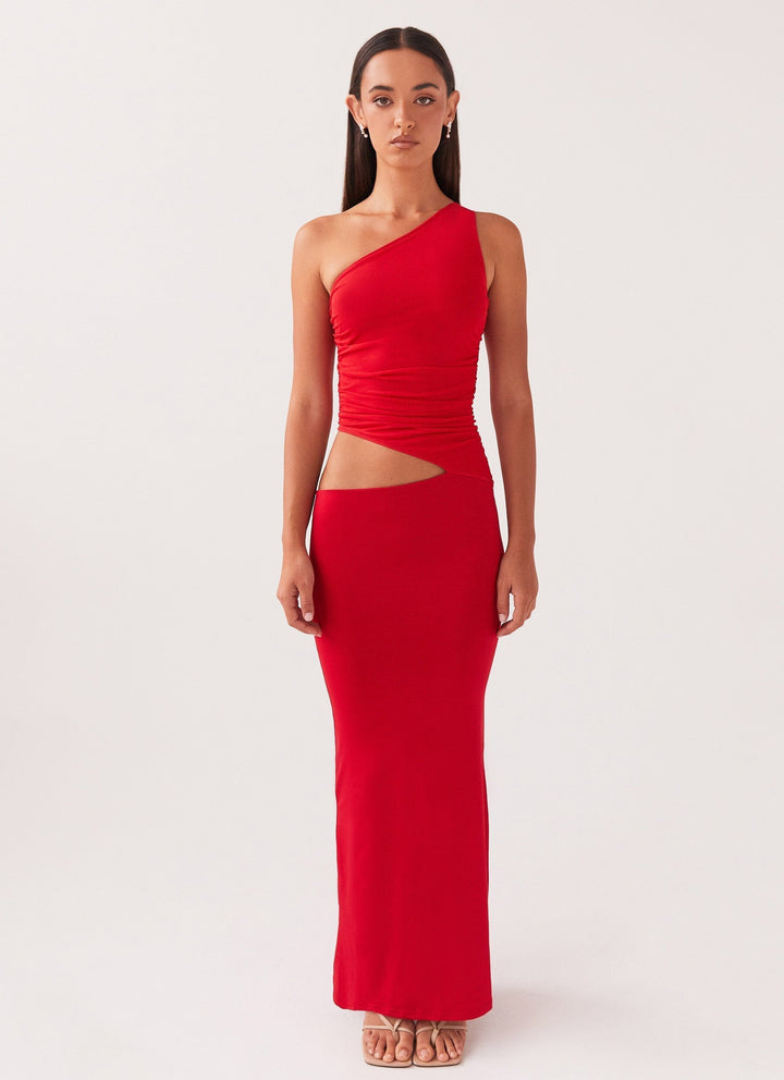 Kvinders lange festkjole med unik one-shoulder og stilfuld cut-out. Smuk til bryllupsgæst.