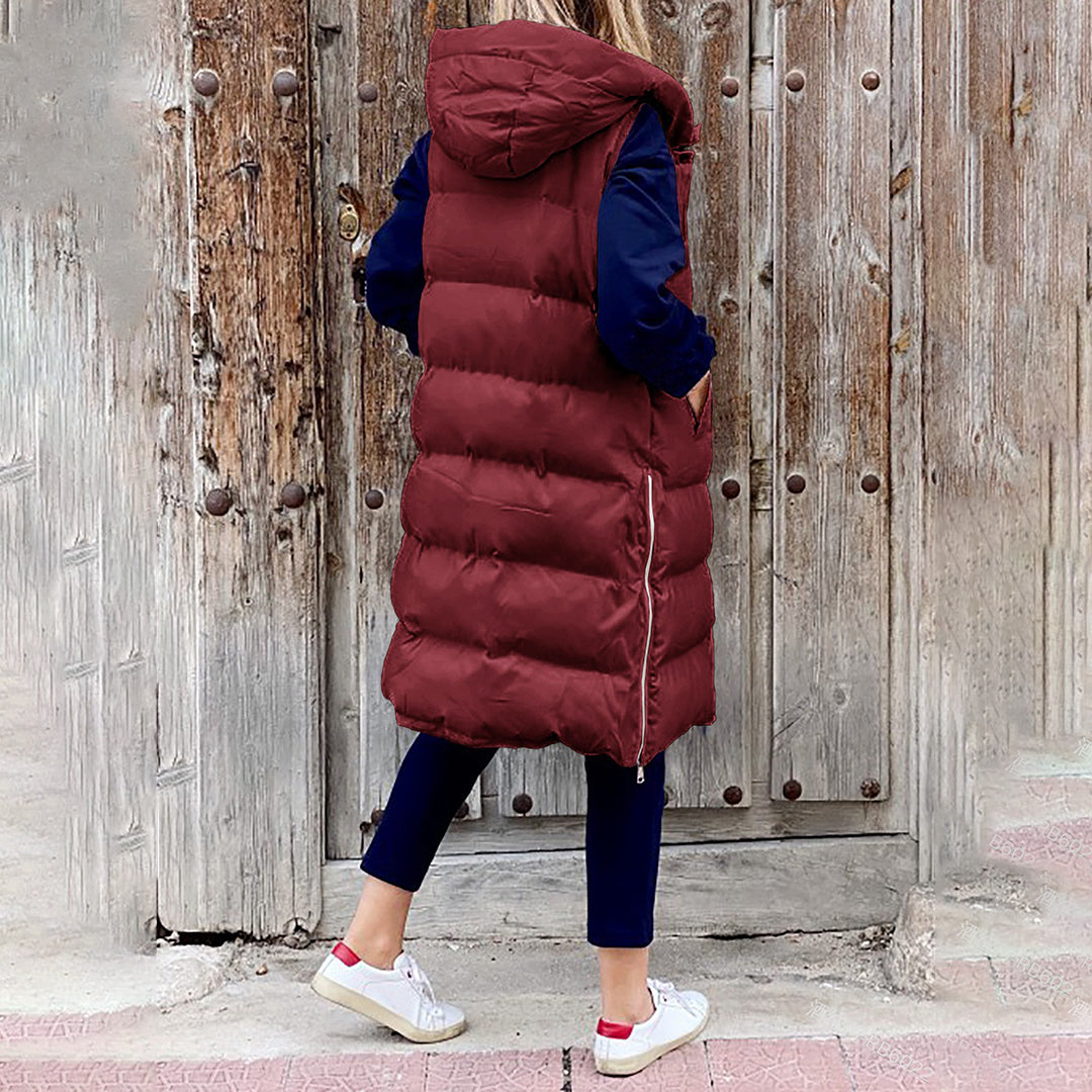 Chic lang damevest, puffer, med hætte. Perfekt til et lag-på-lag look.