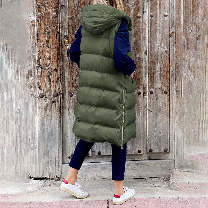 Praktisk og varm lang damevest, puffer stil, med hætte.