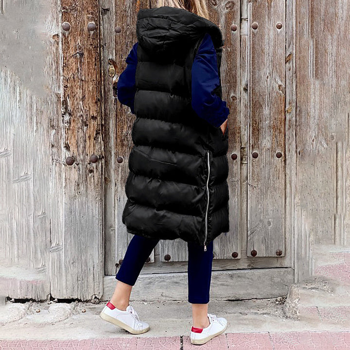 Efterårs- og vintervest: lang dame puffer vest med hætte.