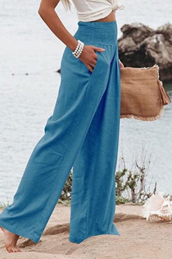 Løse dame strandbukser i åndbar hør med smock talje. Ideelle som afslappede sommer- og komfortbukser.