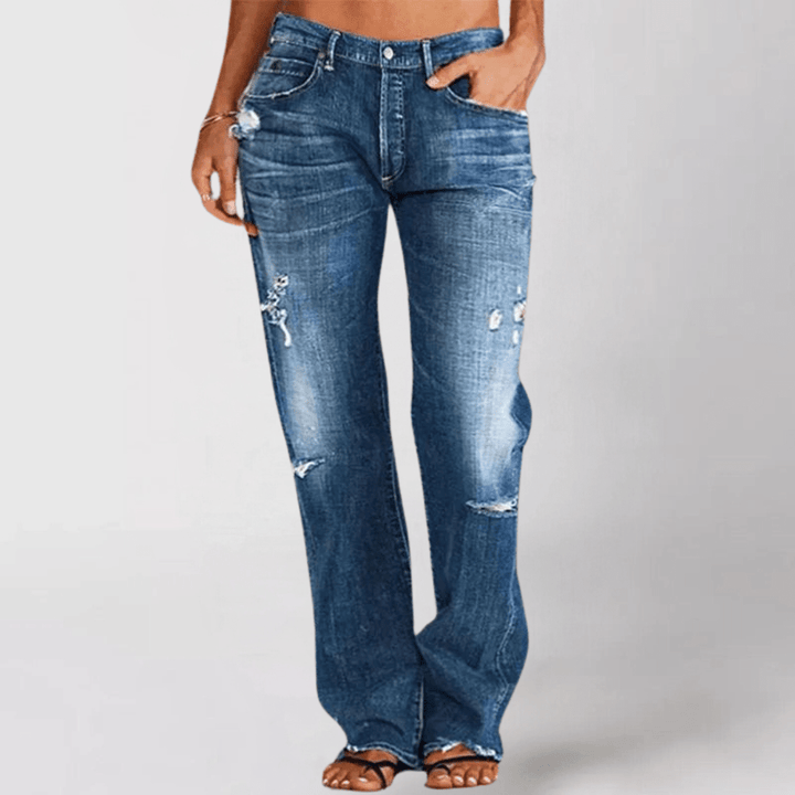 Stilfulde damejeans med vide ben og et trendy distressed look. Komfortable fritidsbukser.
