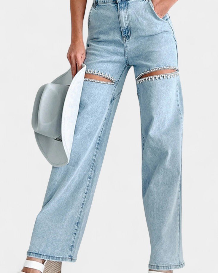 Sorte højtaljede wide leg jeans til damer. Moderne fashion jeans med trendy rå slid for et cool look.