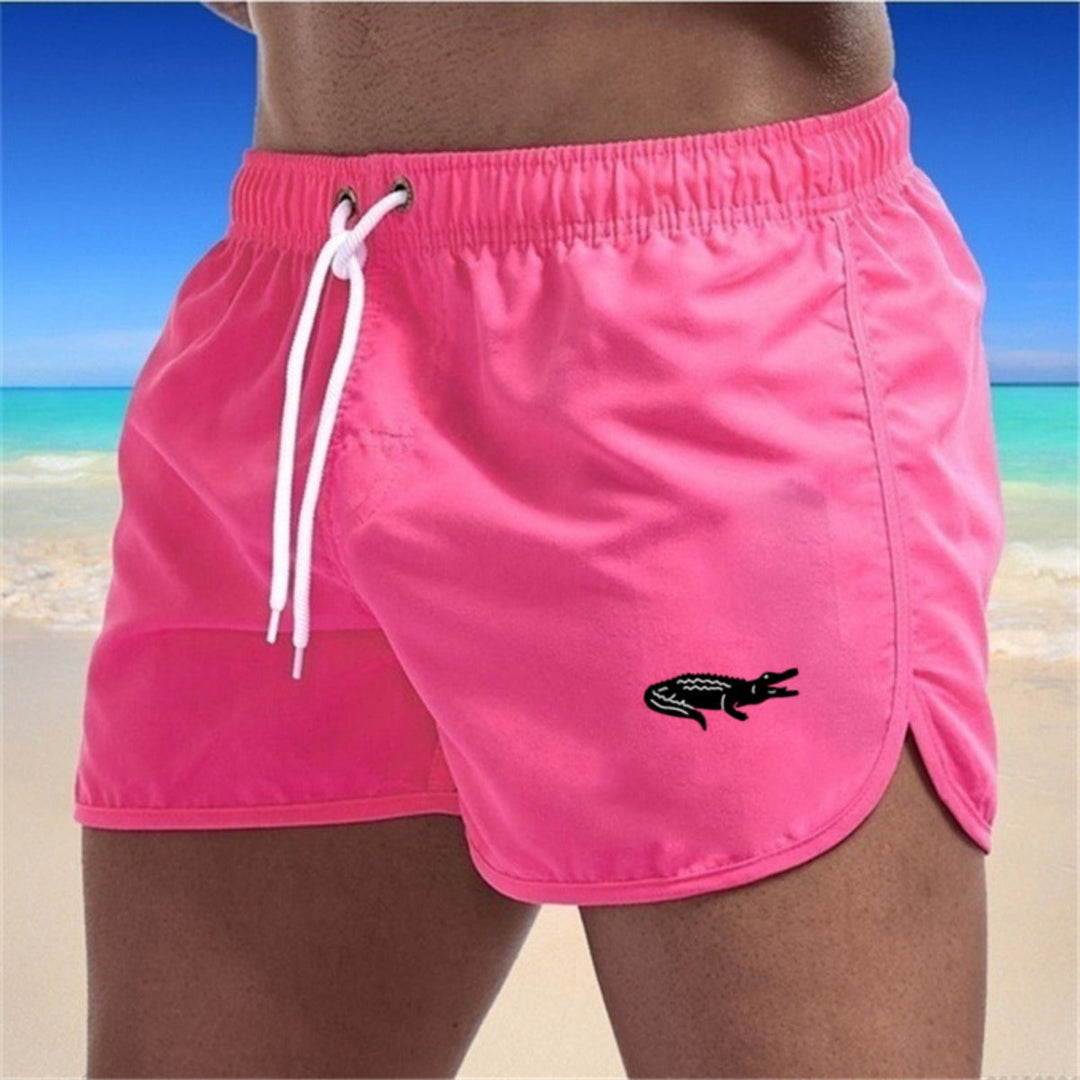 Flerfarvede, lette strandshorts med elastisk talje og moderne print, perfekt til sommer og sport.