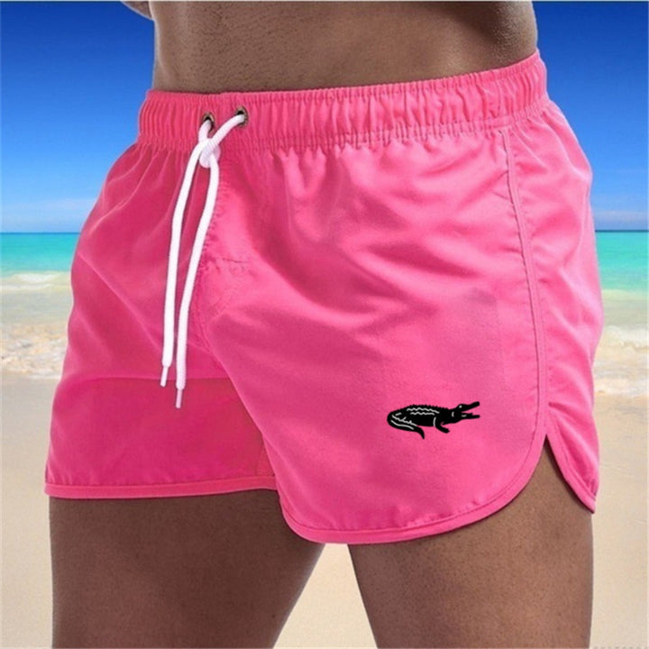 Flerfarvede, lette strandshorts med elastisk talje og moderne print, perfekt til sommer og sport.