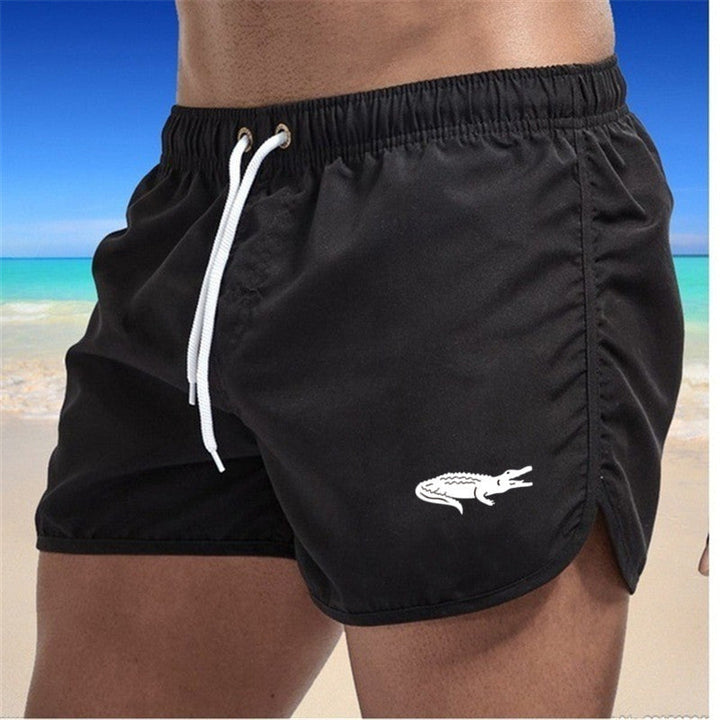 Flerfarvede, lette strandshorts med elastisk talje og moderne print, perfekt til sommer og sport.