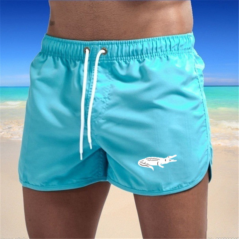 Flerfarvede, lette strandshorts med elastisk talje og moderne print, perfekt til sommer og sport.