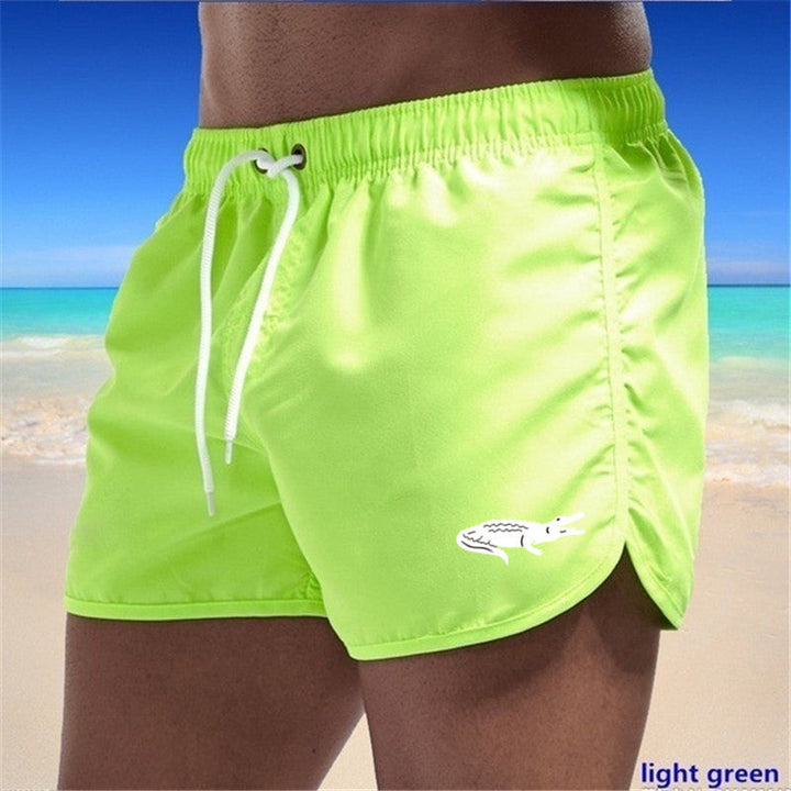 Flerfarvede, lette strandshorts med elastisk talje og moderne print, perfekt til sommer og sport.