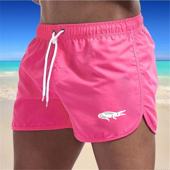 Flerfarvede, lette strandshorts med elastisk talje og moderne print, perfekt til sommer og sport.