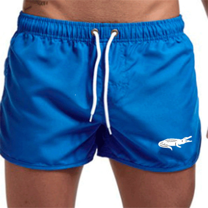 Flerfarvede, lette strandshorts med elastisk talje og moderne print, perfekt til sommer og sport.