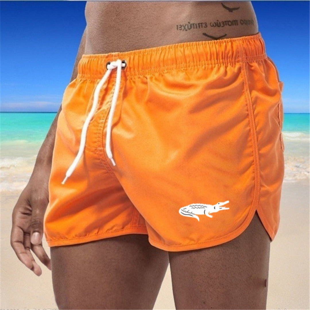 Flerfarvede, lette strandshorts med elastisk talje og moderne print, perfekt til sommer og sport.