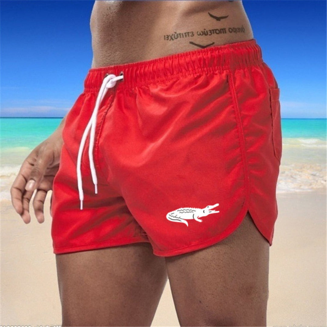 Flerfarvede, lette strandshorts med elastisk talje og moderne print, perfekt til sommer og sport.