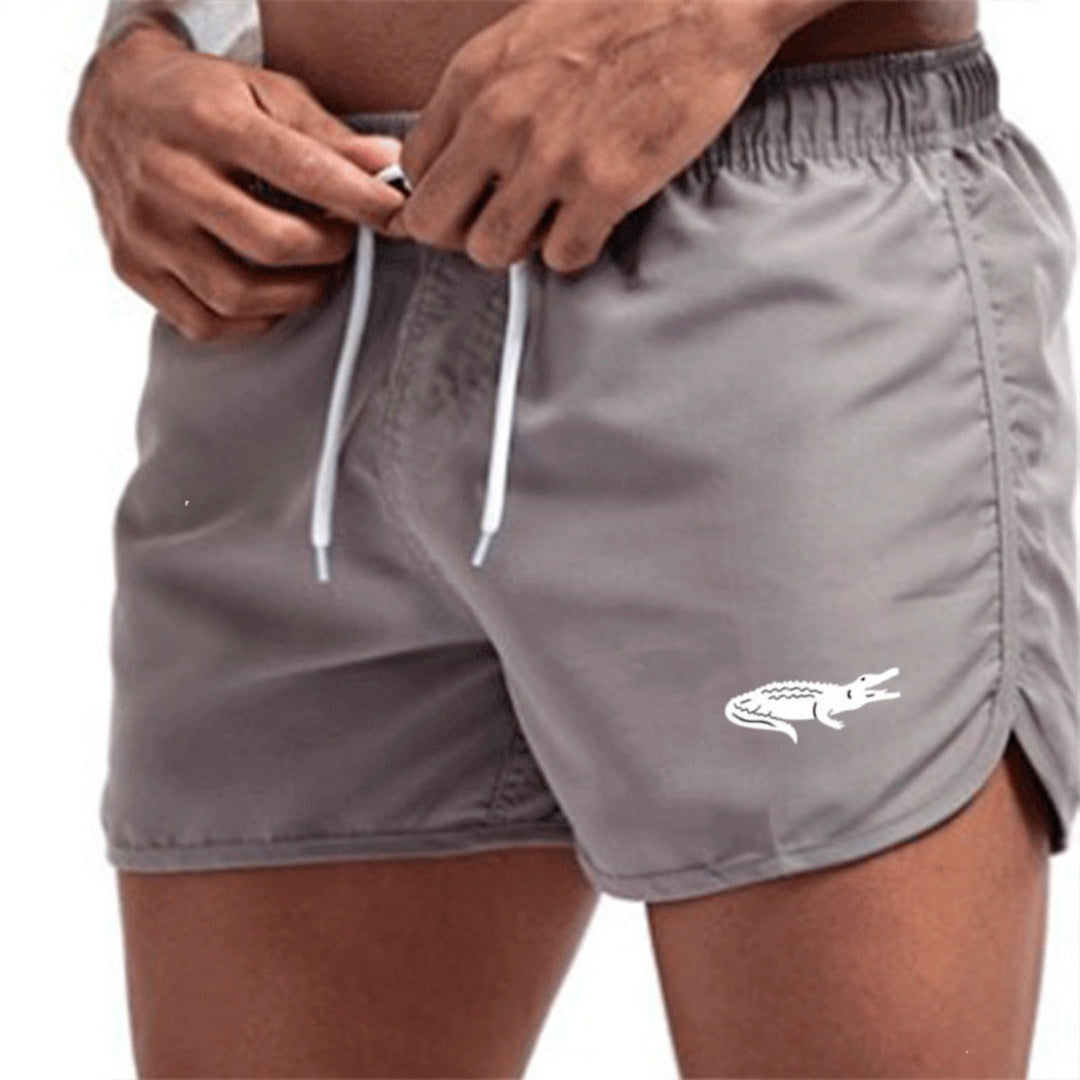 Flerfarvede, lette strandshorts med elastisk talje og moderne print, perfekt til sommer og sport.