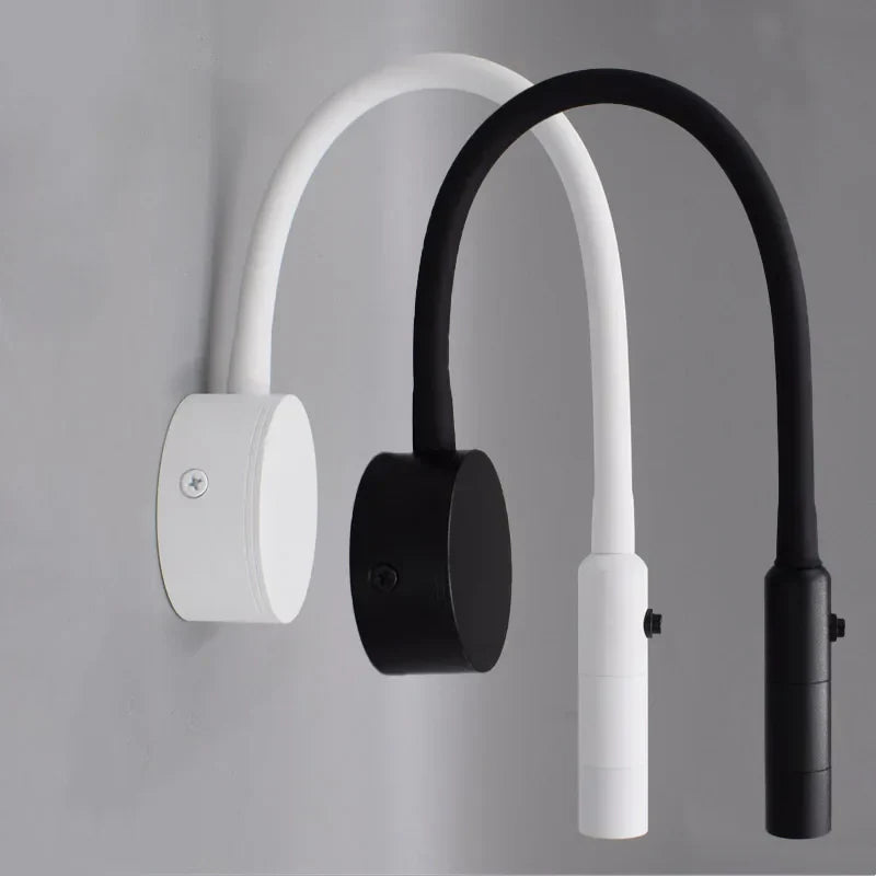 Minimalistisk læse-væglampe med fleksibel arm, LED-teknologi, i sort eller hvid. Ideel til læsning, energibesparende design.