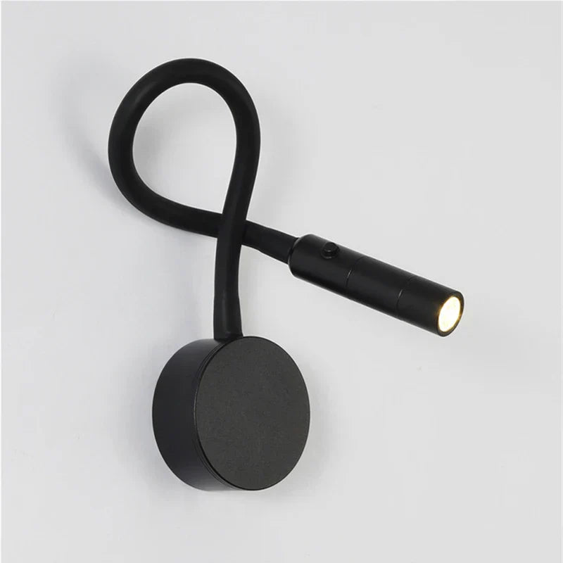 Minimalistisk læse-væglampe med fleksibel arm, LED-teknologi, i sort eller hvid. Enkel at montere, funktionel og elegant.