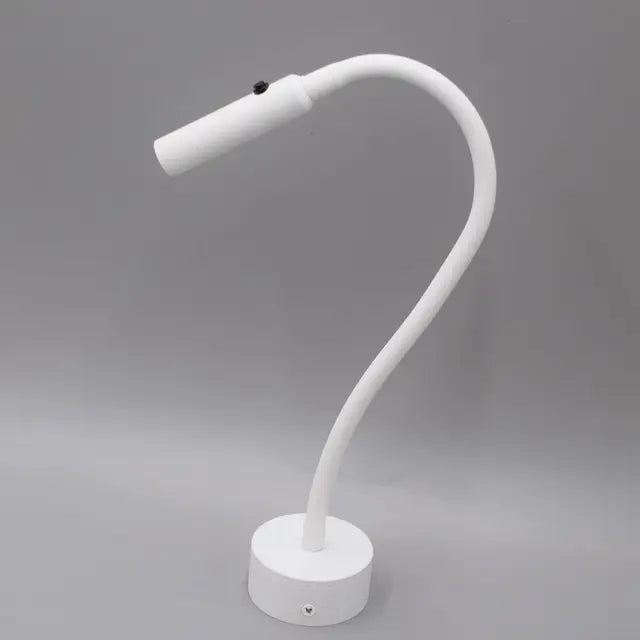 Minimalistisk læse-væglampe med fleksibel arm, LED-teknologi, i sort eller hvid. Øjenvenligt lys til lange læsesessioner.