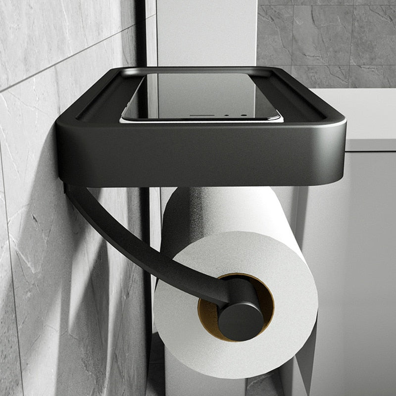 Borefri toiletpapirholder i aluminium med hylde, perfekt til opbevaring i badeværelset.