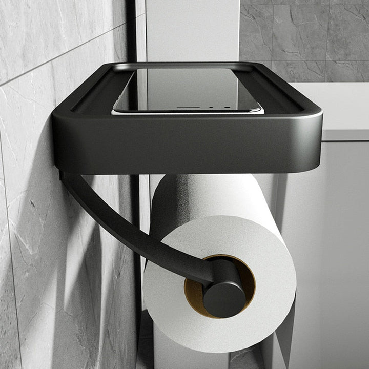 Borefri toiletpapirholder i aluminium med hylde, perfekt til opbevaring i badeværelset.