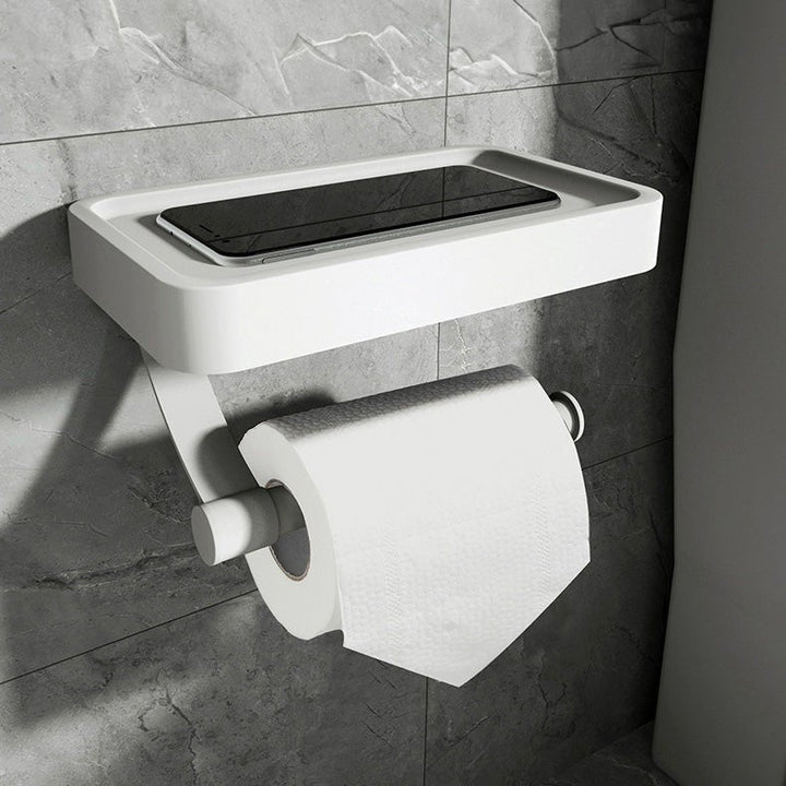 Hvid toiletpapirholder med integreret hylde, ideel til vægmontering og opbevaring på badeværelset.